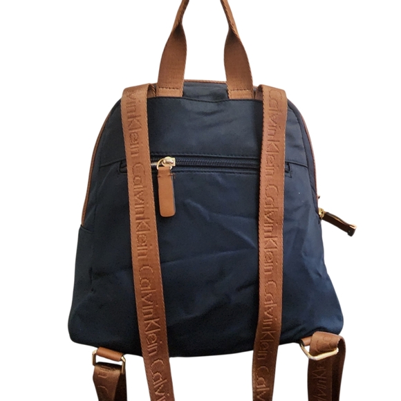 Calvin Klein Navy Backpack with Brown Trim and Gold Accents Preloved - Picture 2 of 12